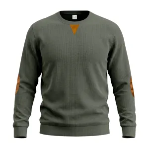 Dark green ribbed men's long sleeve sweatshirt detail, featuring brown elbow patches.