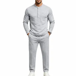 Close-up view of casual gray mens henley shirt and trousers set featuring textured knit fabric.
