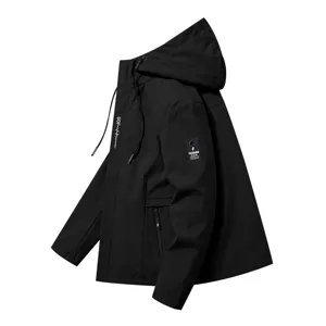 Men's black hooded windbreaker detail view featuring chest print and sleeve patch design.