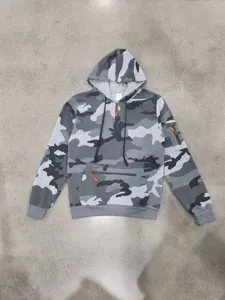 Grey camo hoodie detail featuring quarter-zip closure, orange zipper pulls, and tactical pockets.