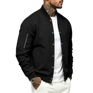 Men's black bomber jacket detail showing sleeve zipper pocket, snap buttons and ribbed collar.