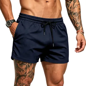 Detail shot of men's breathable mesh athletic shorts in dark blue with adjustable drawstring.