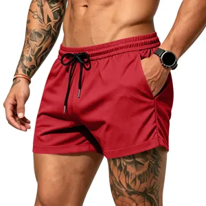 Detailed view of red quick-dry athletic mesh shorts with black drawstring and pockets.
