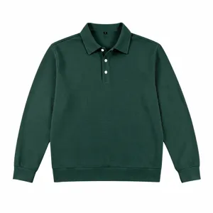 Detailed view of the dark green men's long sleeve waffle knit polo shirt with button collar.