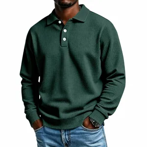 Detailed view of the dark green waffle knit long sleeve polo shirt texture and collar.
