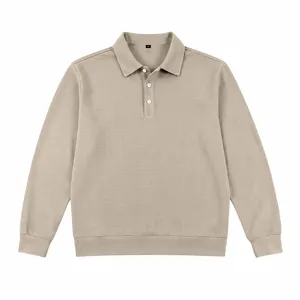 Waffle knit long sleeve polo shirt detail showing button placket and collar texture.