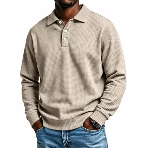 Close-up view of men's waffle knit long sleeve polo shirt texture and collar details.