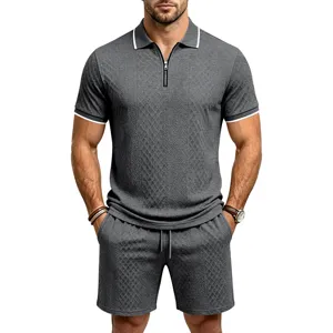 Close-up of men's textured jacquard knit fabric, showing collar trim and zipper detail.