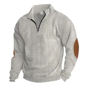 Close-up of men's half-zip ribbed sweatshirt featuring stand collar and brown elbow patches.