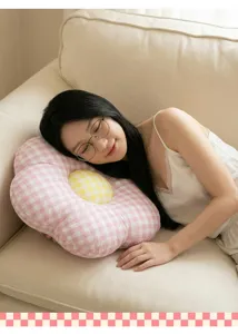 Cozy plaid flower plush pillow in home sofa scene, soft cushion for living room decor.