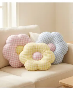 Cozy checkered flower cushion detail, soft plush material for home sofa decor and comfort.