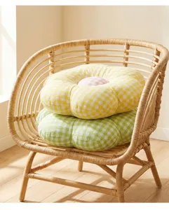 Plush flower cushion detail, cute plaid floor mat and soft sofa pillow for home decoration.