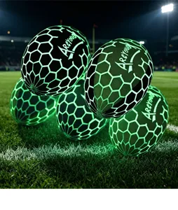 Glowing rugby plush pillow toy detail view, creative luminous football doll on grass field.