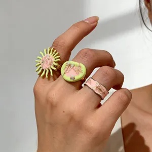 Detail shot of Y2K handmade enamel butterfly pearl rings, vintage sweet and cool jewelry.