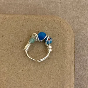 Handmade wire wrapped ring with colorful beaded detail, adjustable open band fashion jewelry.