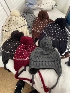 Detailed view of the Korean style cute knitted pom-pom beanie with warm earflaps in multiple colors.