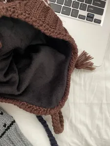 Knit earflap beanie winter warm thick fleece lined brown hat with braided tassels detail