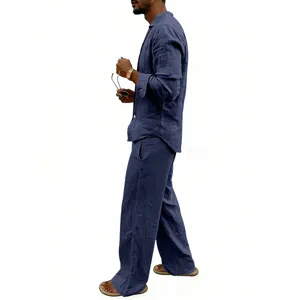 Detailed view of men's casual navy blue linen long sleeve shirt and matching wide-leg trousers.