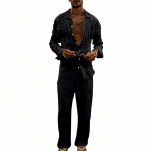 Detail view of men casual linen long sleeve shirt and straight pants set black breathable fabric.