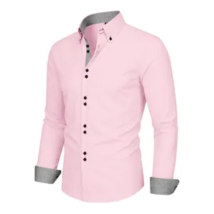 Close-up detail of mens pink dress shirt with contrast geometric collar and double button cuffs.