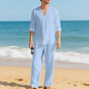 Men casual linen beach outfit detail view, light blue long sleeve shirt and matching pants.