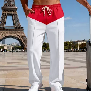 Detail shot of mens colorblocked casual straight pants with drawstring waist in urban style.