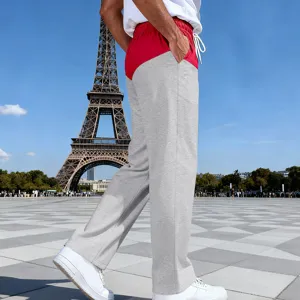 Detail view of men casual color blocked straight leg sweatpants with drawstring waist.