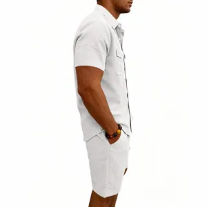 Side view detail of men's casual textured short sleeve button shirt and matching summer shorts.