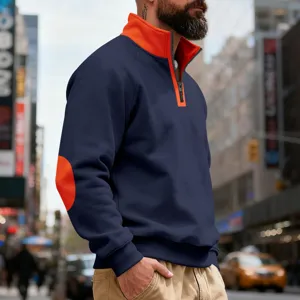 Men's half zip stand collar sweatshirt detail view featuring contrast orange elbow patch.