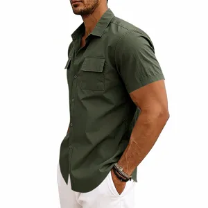 Close-up detail of men's dark green short-sleeve utility shirt with double chest pockets.