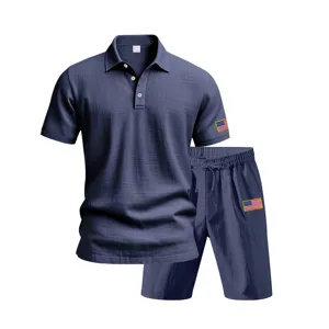 Detail shot of dark blue mens casual linen polo shirt and shorts set with flag embroidery.
