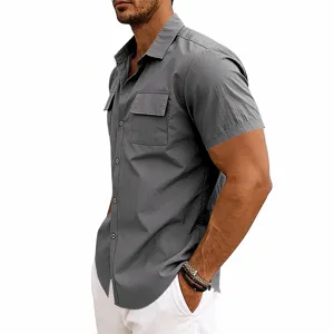 Close-up detail view of mens grey short sleeve utility shirt featuring dual chest pockets and collar.