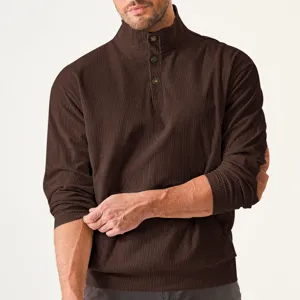 Detail shot of men brown corduroy mock neck long sleeve shirt with buttons and elbow patch.