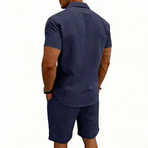 Back detail of men's short sleeve corduroy shirt and shorts set in dark blue color.