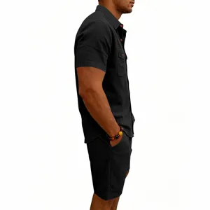 Detail view of men's summer casual short sleeve shirt and shorts set in black textured fabric.
