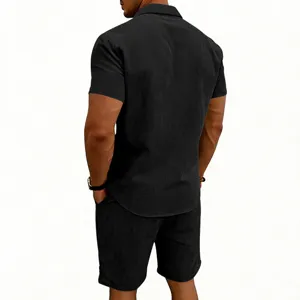 Back view of men's black corduroy short sleeve shirt and shorts set, detailed texture design.