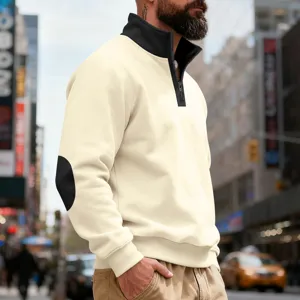 Men's quarter-zip fleece sweatshirt detail with contrast stand collar and elbow patches.