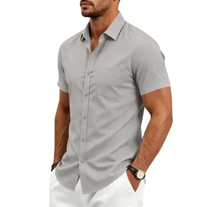 Detailed view of men's grey short sleeve shirt featuring classic lapel and front chest pocket.