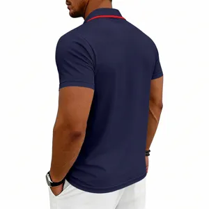 Back detail view of the solid dark blue short sleeve polo shirt with red collar trim.