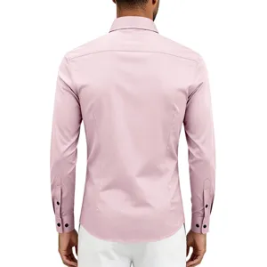 Detailed back view of men's slim fit long sleeve dress shirt in light pink with black buttons.