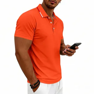 Details of men's short sleeve polo shirt in bright orange with contrast collar stripes.