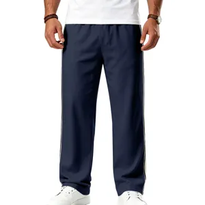 Pantalon de sport homme détail bande latérale, survêtement ample fitness course à pied.