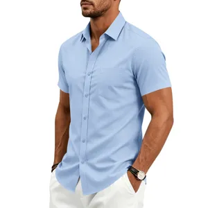 Close-up detail of men's light blue short sleeve dress shirt with chest pocket and lapel.