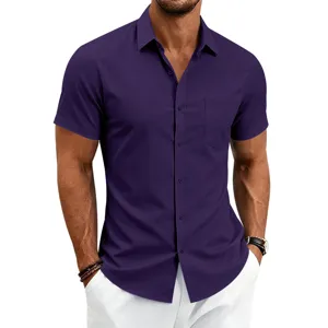 Close-up detail of the purple short sleeve shirt featuring a classic collar and chest pocket.
