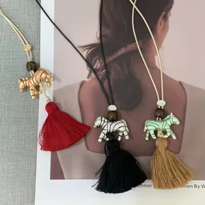 Hand-painted zebra pendant necklace with tassel long sweater chain fashion jewelry.