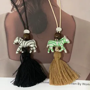 Designer hand-painted zebra tassel necklace, stylish long sweater chain for women.