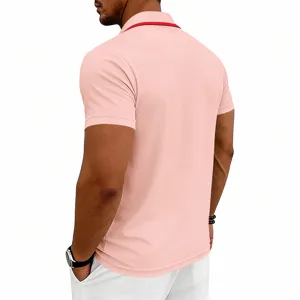 Back view detail of men's short sleeve solid pink polo shirt with red collar trim.