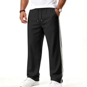 Pantalon de survêtement décontracté ample droit pour homme avec bandes latérales blanches.