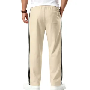 Pantalon de survêtement ample pour homme avec bandes latérales contrastées, coupe droite.
