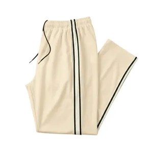 Pantalon de survêtement homme beige bande latérale sport fitness coupe droite confortable.